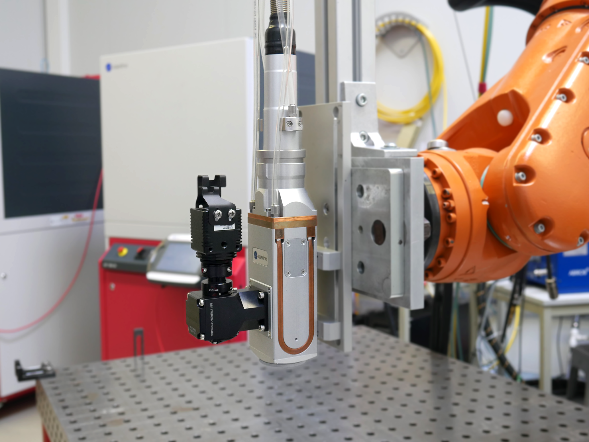 An OTC3 with a robot in a laboratory by Laserline diode lasers